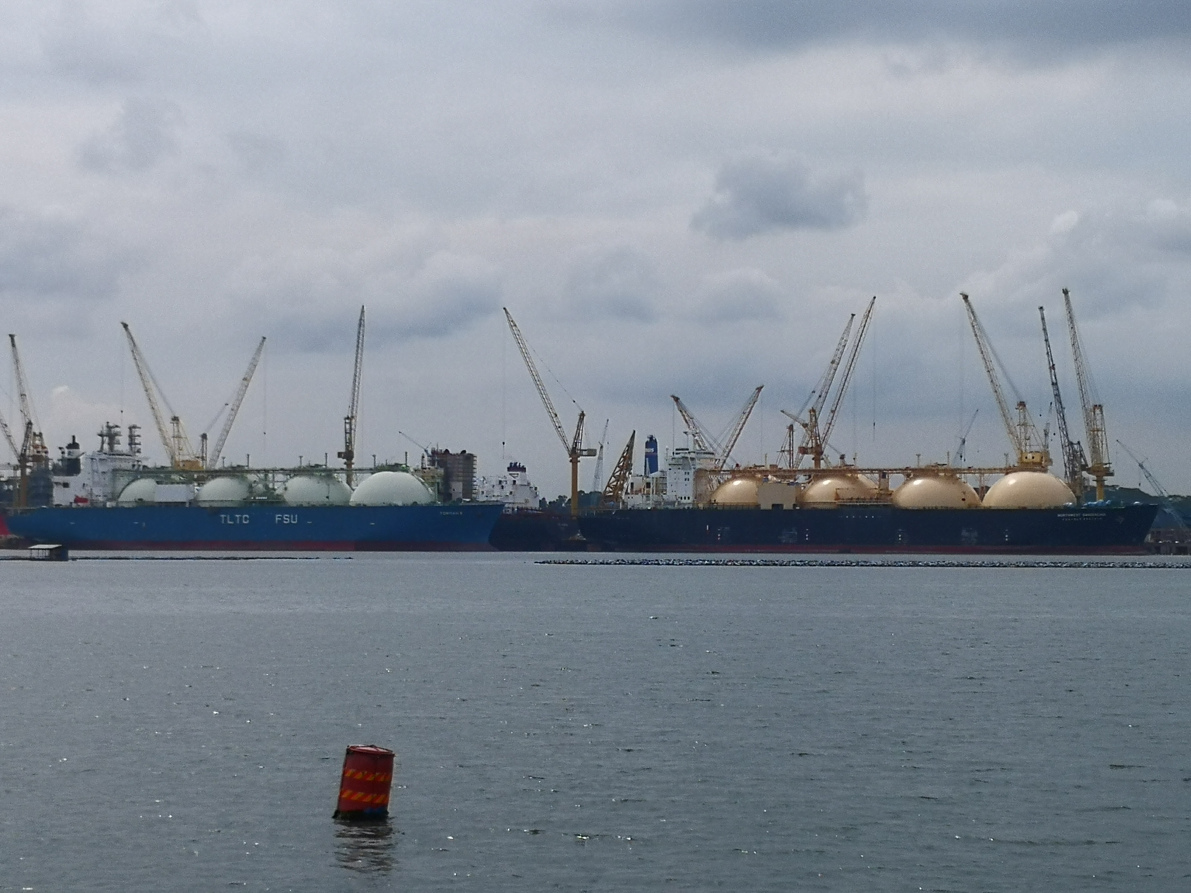 LNG carriers at anchor off Singapore, the kind of vessels that will move Malaysian gas to Japan under the new Petronas-JERA deal