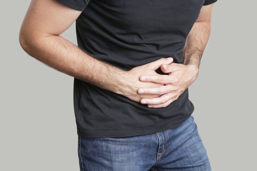 A man consulting a doctor about chronic pelvic pain and CP/CPPS diagnosis
