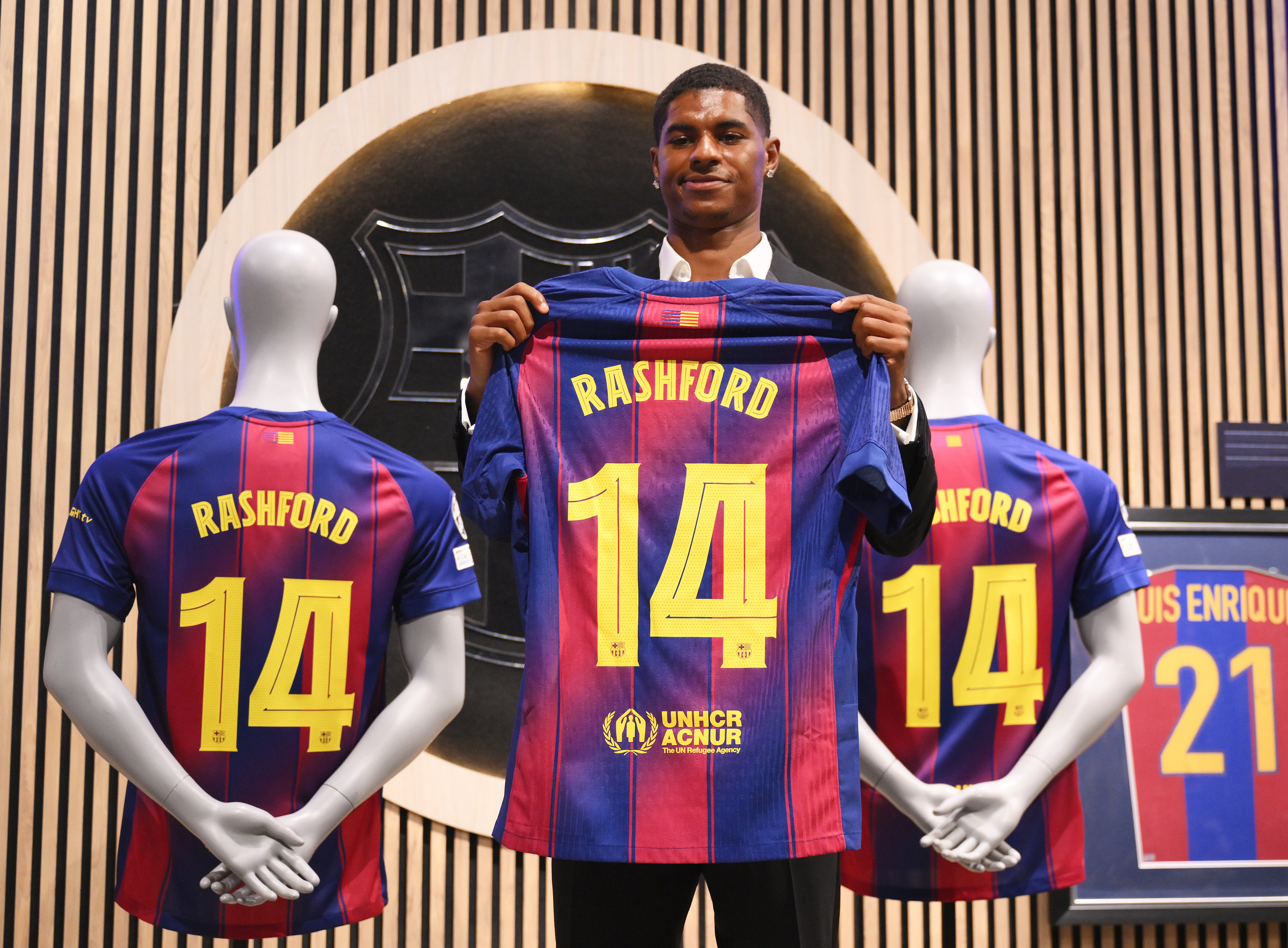 Marcus Rashford holds up his Barcelona shirt at his unveiling at the Camp Nou in July 2025, ahead of a loan spell that has complicated his Manchester United future