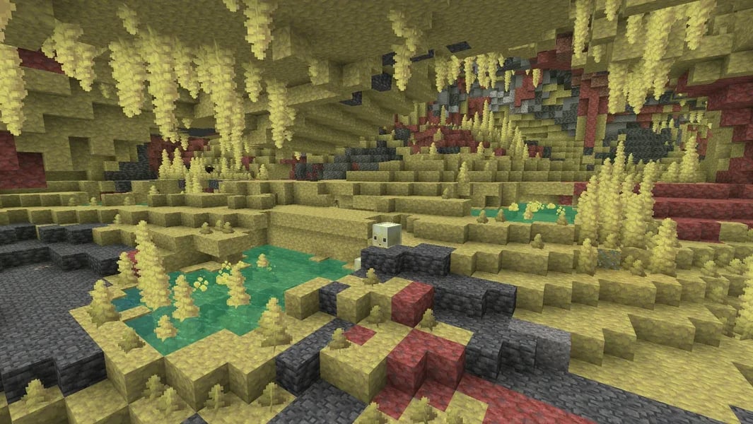 Minecraft Chaos Cubed Sulfur Caves biome with yellow sulfur blocks and red cinnabar in the 26.2 update