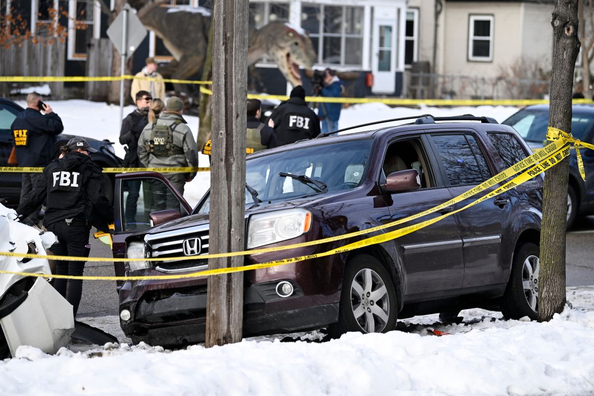 Law enforcement officers at the scene of a deadly immigration raid in Minneapolis