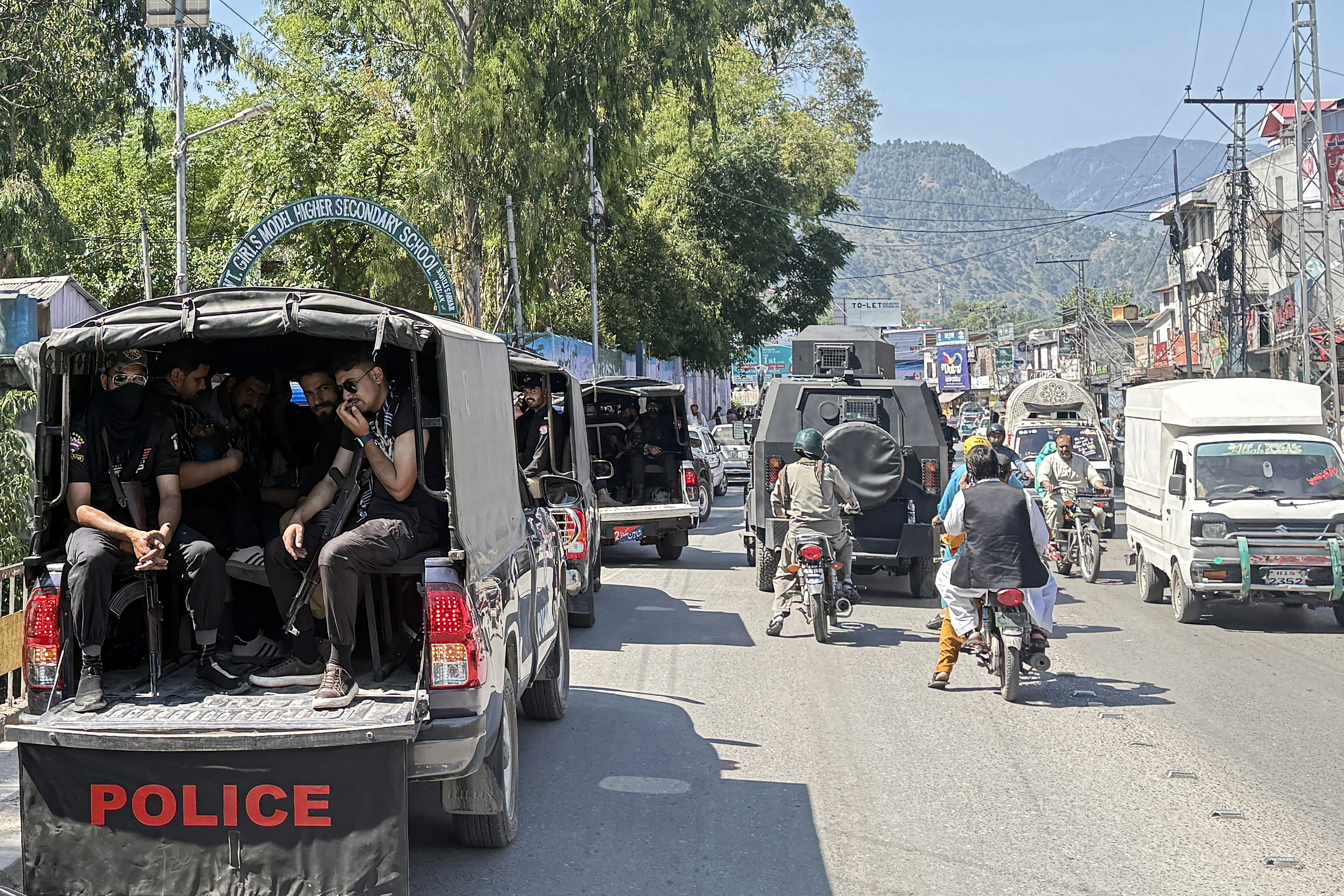 Security personnel patrol Muzaffarabad on the eve of the Joint Awami Action Committee rally, days after the group was banned under anti-terror laws