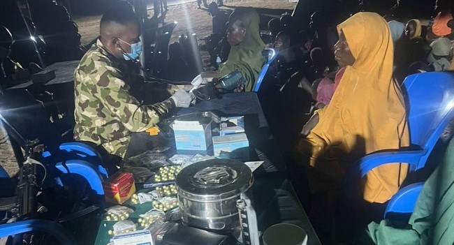 Rescued victims from Borno Boko Haram enclave receiving medical care from Nigerian military personnel