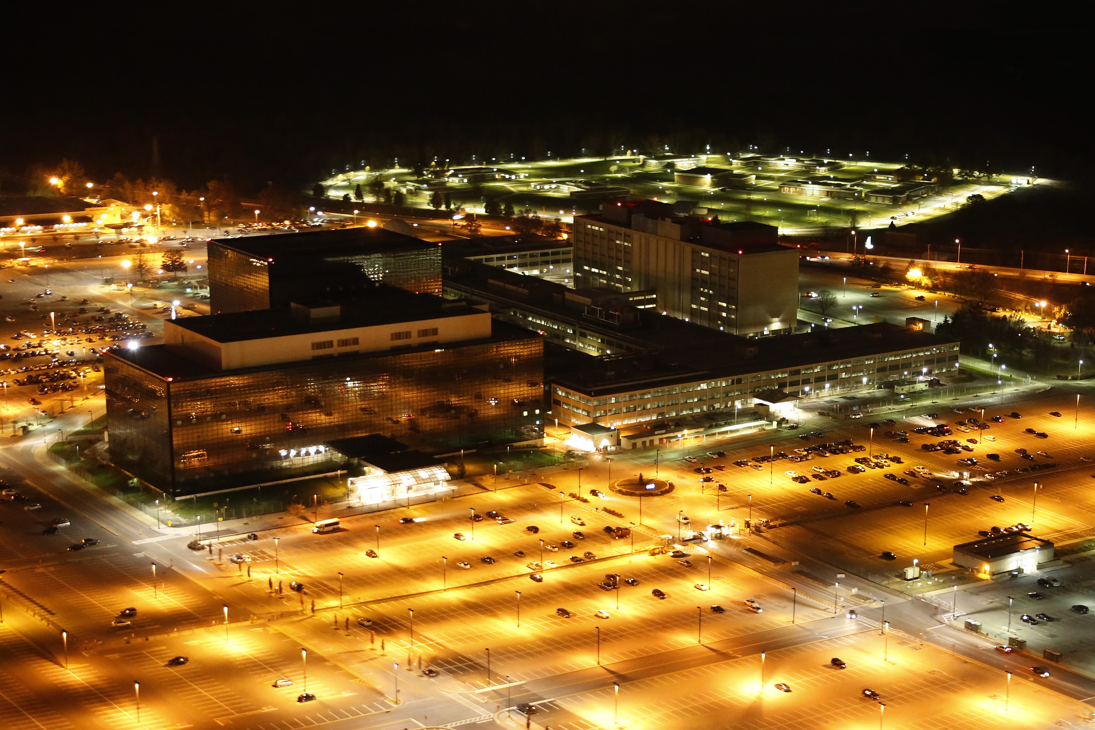Aerial view of NSA headquarters at Fort Meade, whose Section 702 collection continues despite the statute's lapse