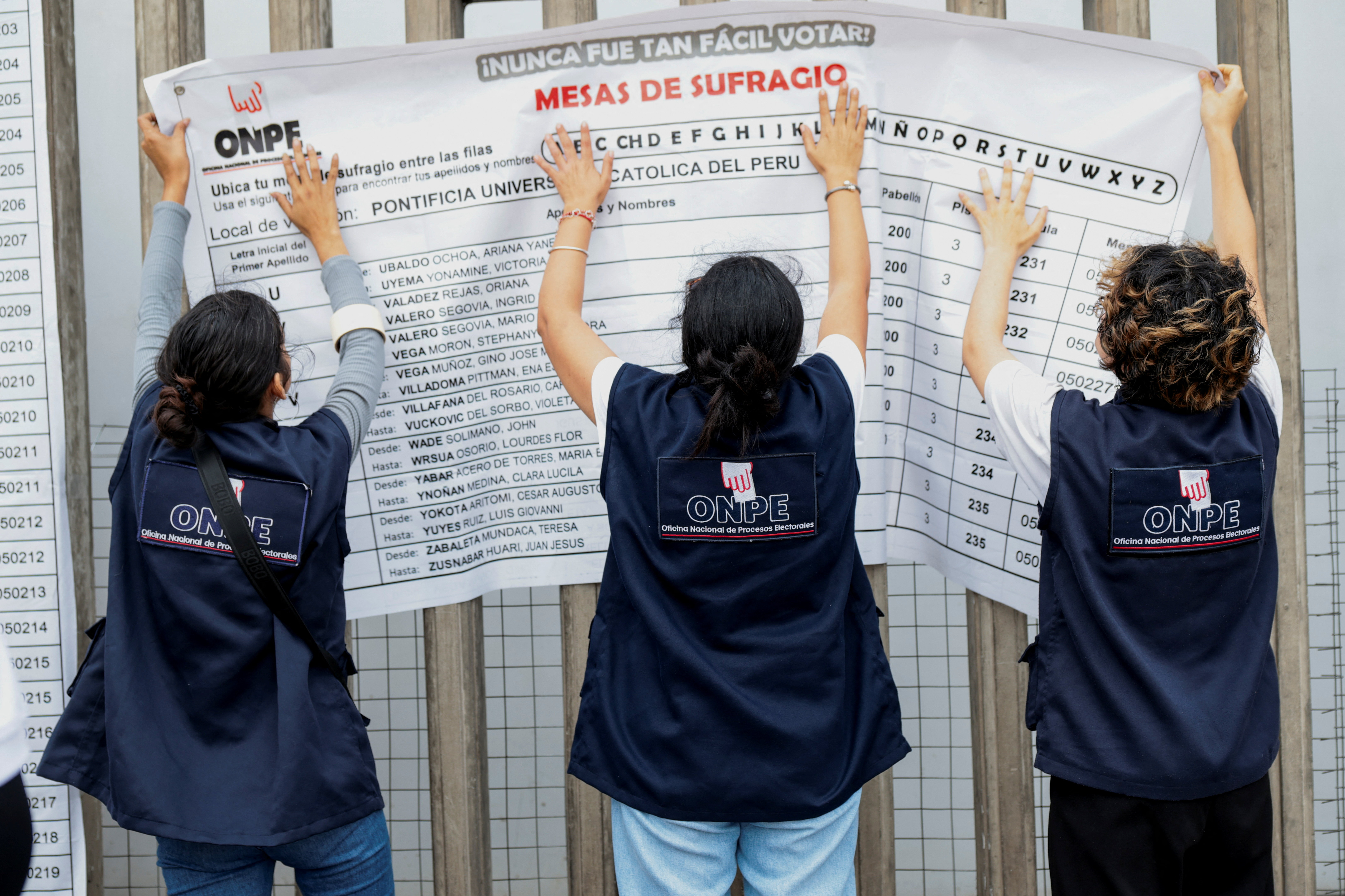 Electoral workers at a polling station in Lima during Peru's 2026 presidential runoff between Keiko Fujimori and Roberto Sanchez