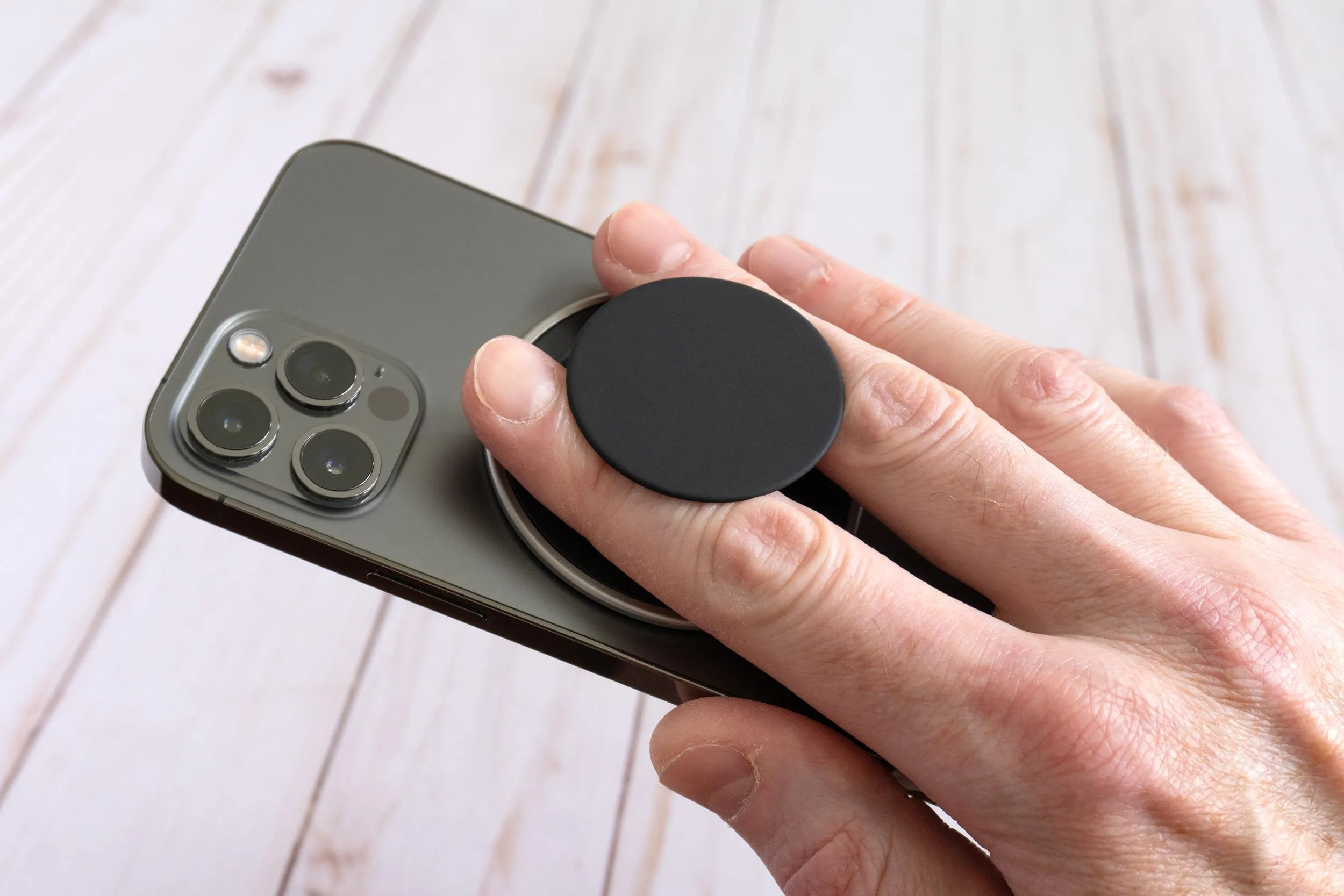 PopSockets Low-Pro Grip attached to an iPhone showcasing its ultra-thin MagSafe-compatible design