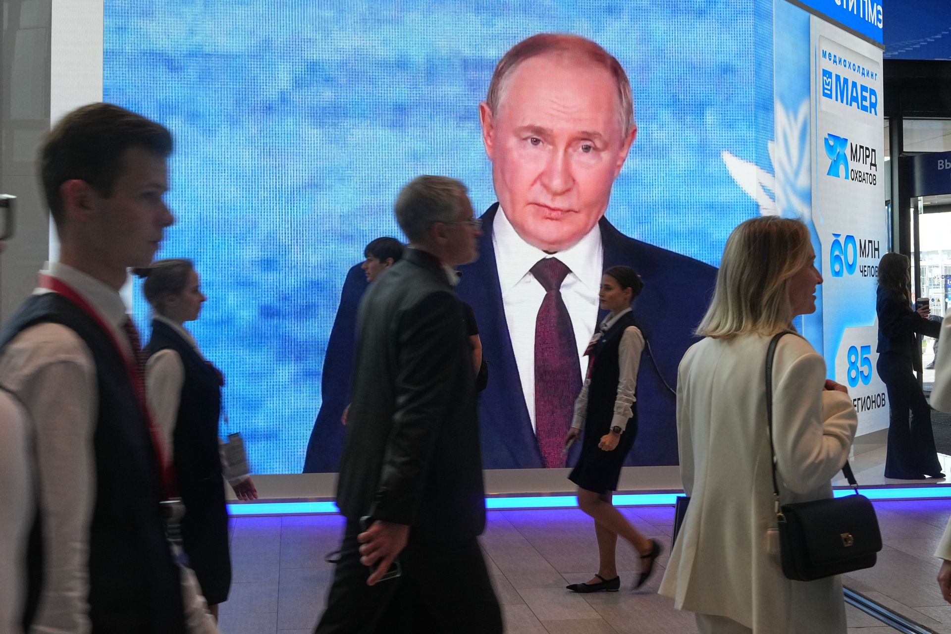 Screen showing Putin at the St. Petersburg International Economic Forum 2026 Russia GDP economy