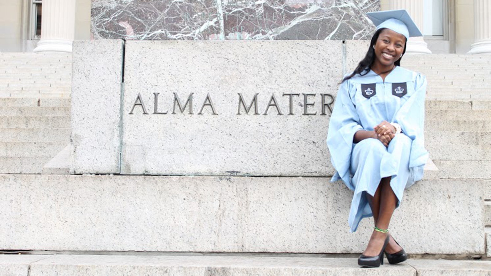 A graduate at a university campus