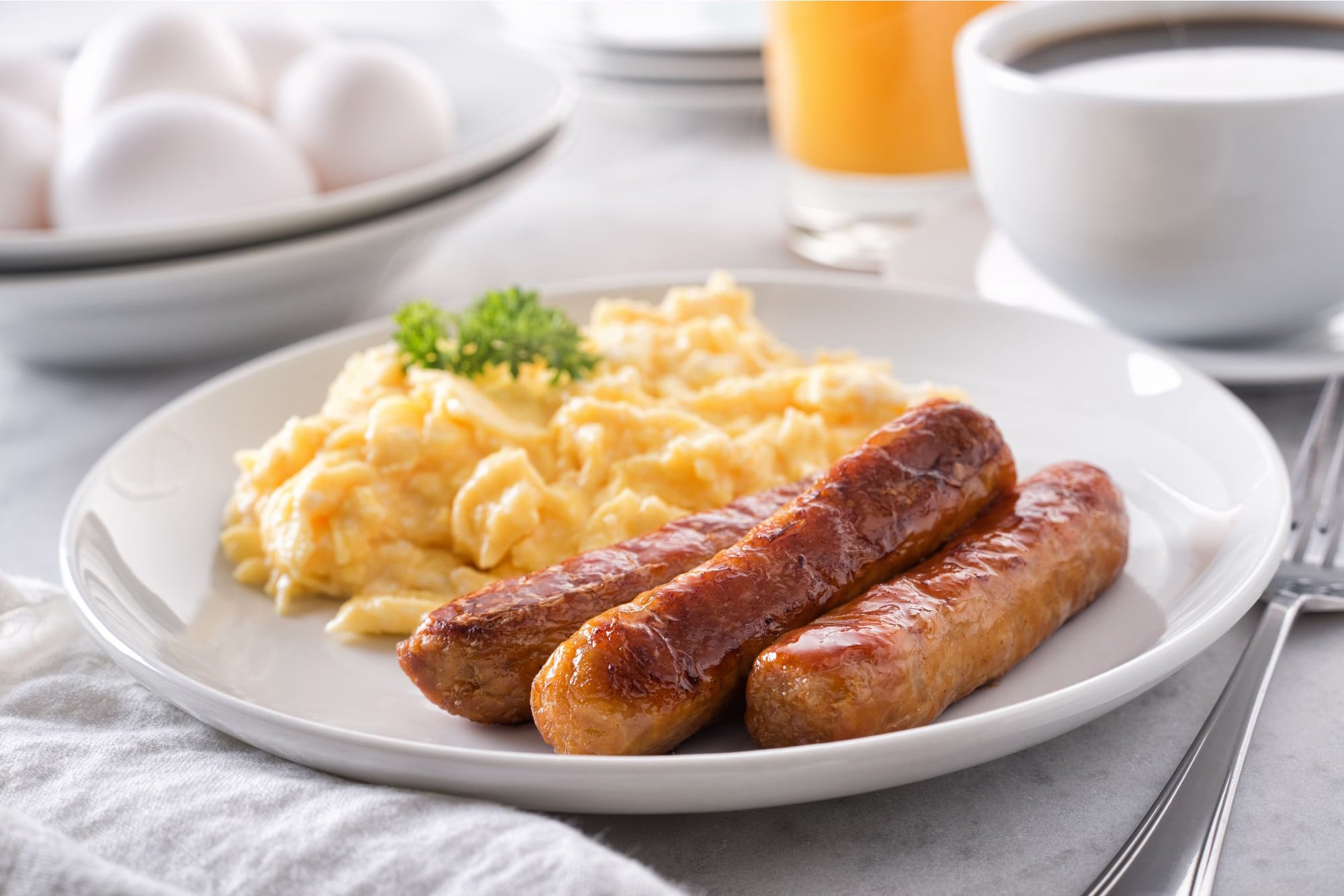 Scrambled eggs and sausage breakfast plate illustrating animal-based protein sources in Purdue University essential amino acid study