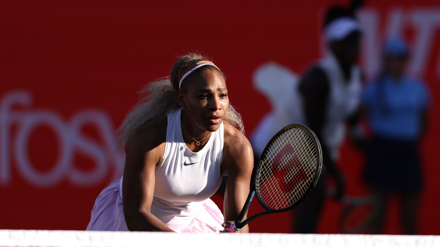 Serena Williams serves during her winning doubles comeback match with Victoria Mboko at Queen's Club in London