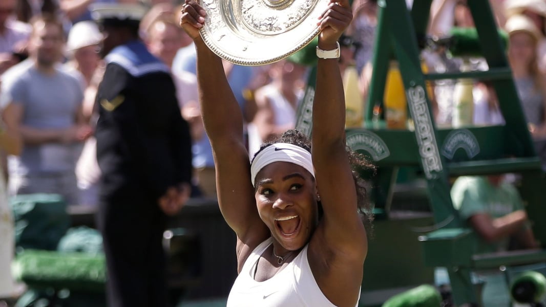 Serena Williams holds the Wimbledon trophy after winning her seventh title at the All England Club