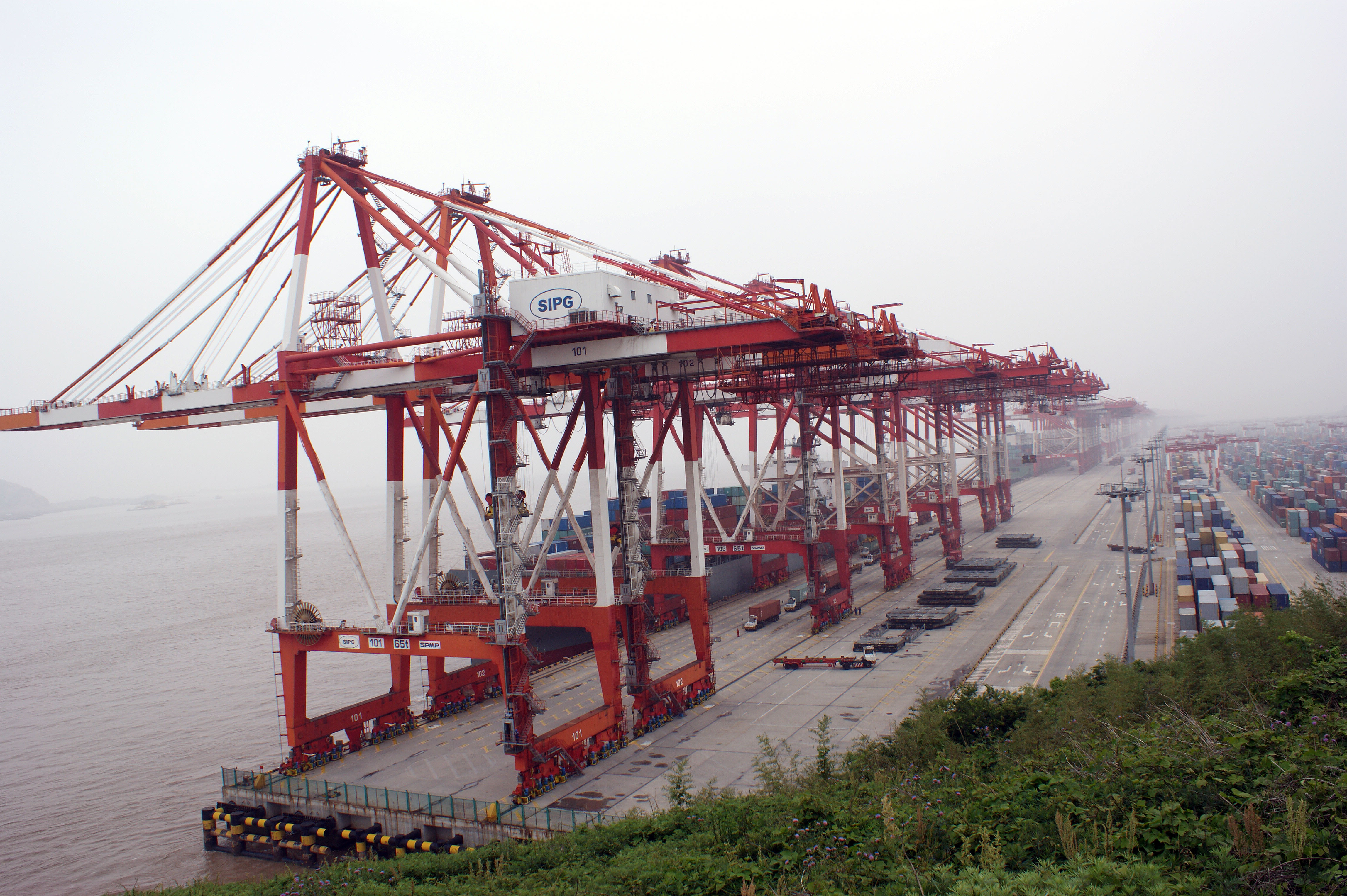 Rows of shipping containers stacked at the Yangshan port terminal near Shanghai