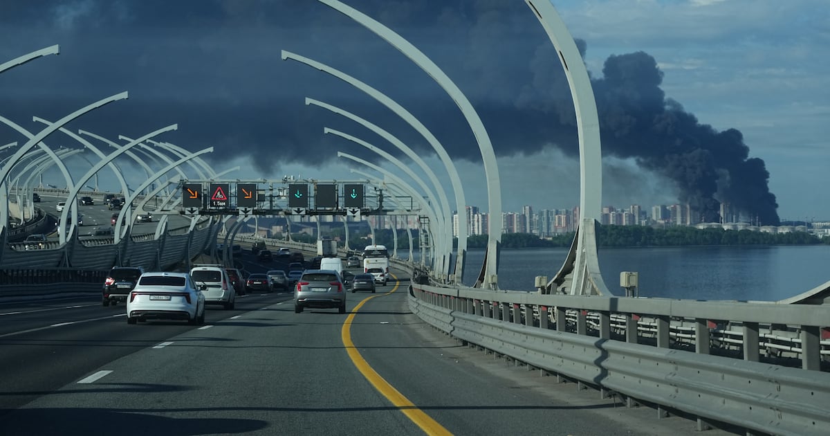 Black smoke rises over the port of St. Petersburg as the SPIEF 2026 economic forum opens