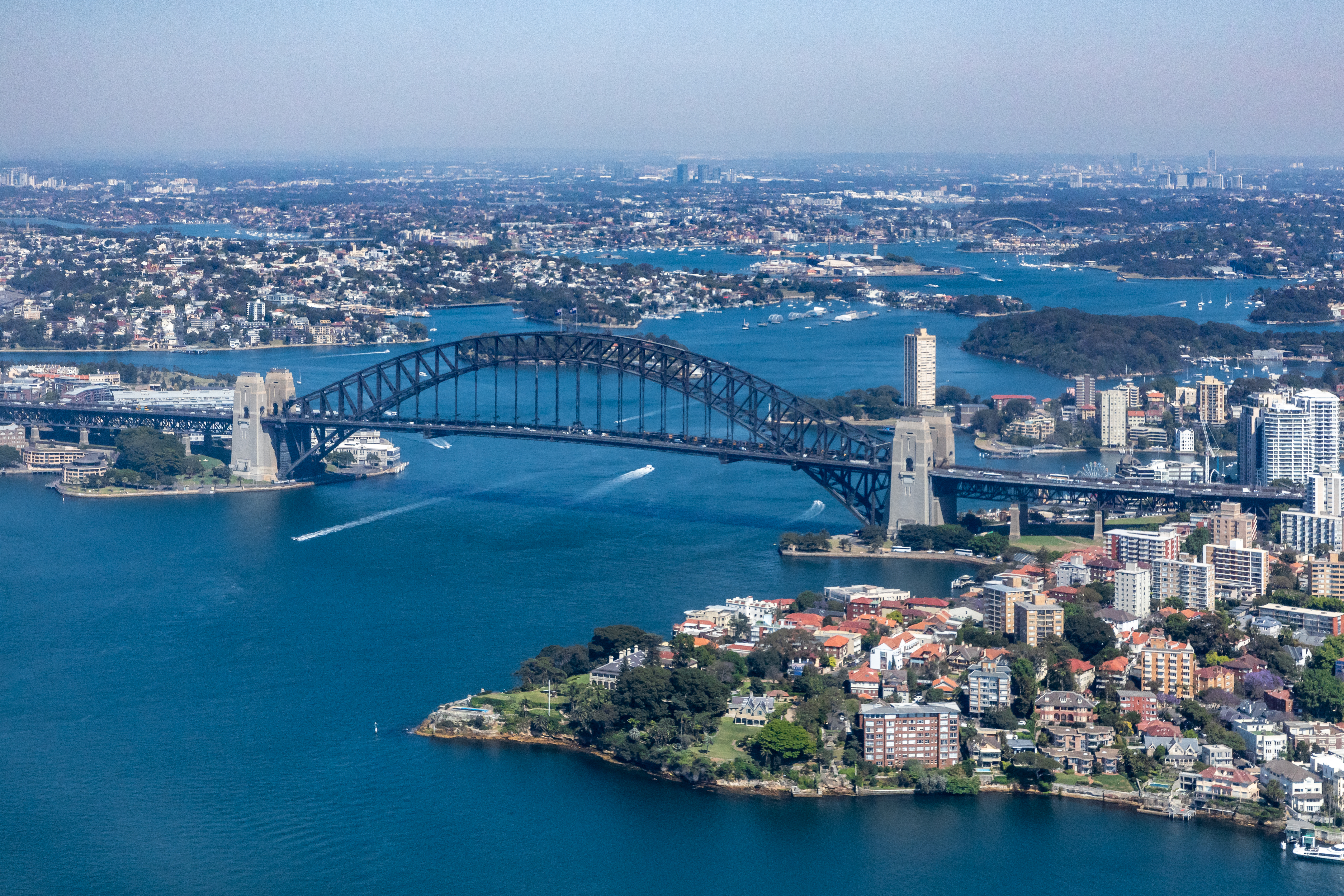 The Sydney Harbour Bridge in Sydney, capital of New South Wales, whose economy a new report finds is already 18 percent smaller from climate change