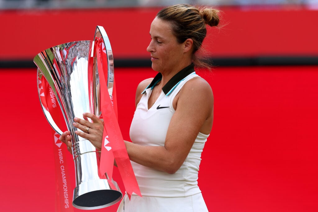 Tatjana Maria celebrates holding the Queen's Club women's singles trophy after her 2025 title win