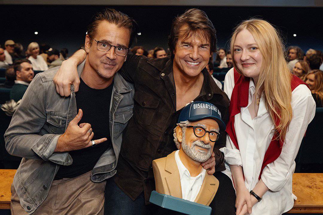 Tom Cruise smiling at the Disclosure Day screening alongside his Spielberg co-stars