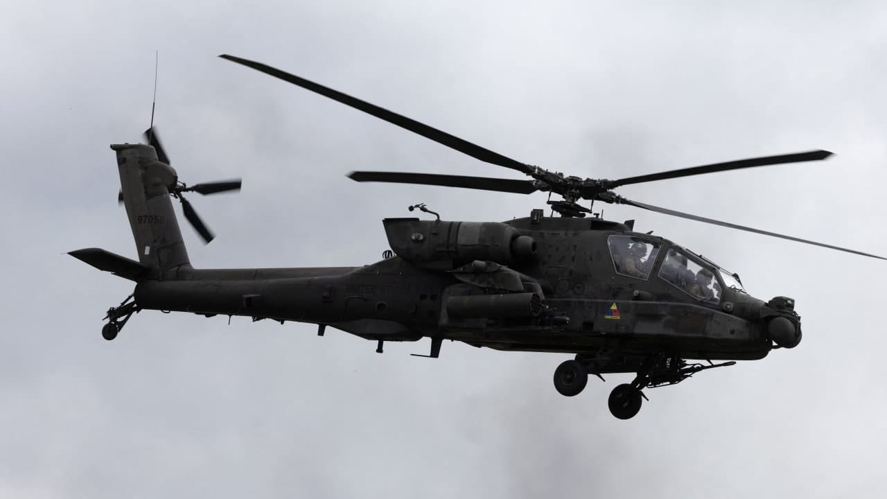 US Army AH-64 Apache helicopter patrolling near the Strait of Hormuz during Iran war operations 2026