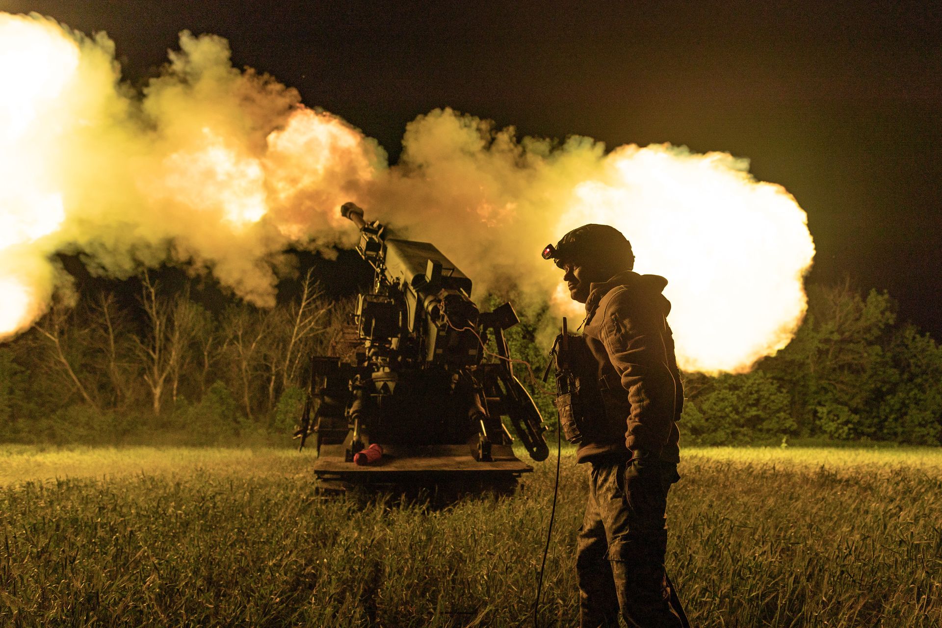 Ukrainian soldiers from the 30th Brigade fire a Bohdana self-propelled howitzer at Russian positions in Donetsk Oblast, Ukraine, May 2026