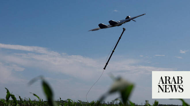 Ukrainian soldiers launch a drone in a field in eastern Ukraine targeting Russian positions, 2026