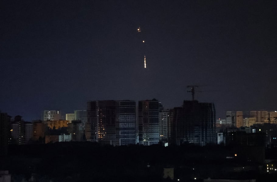 Ukrainian drone explodes in the night sky above Kyiv during a Russian drone attack