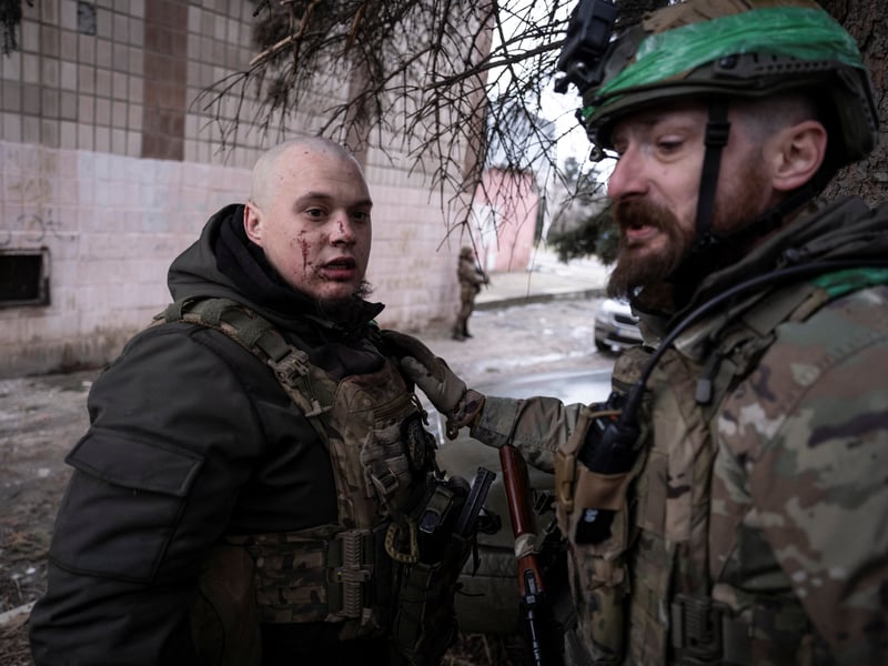 Ukrainian soldier assists injured comrade during medical evacuation Druzhkivka Donetsk region February 2026