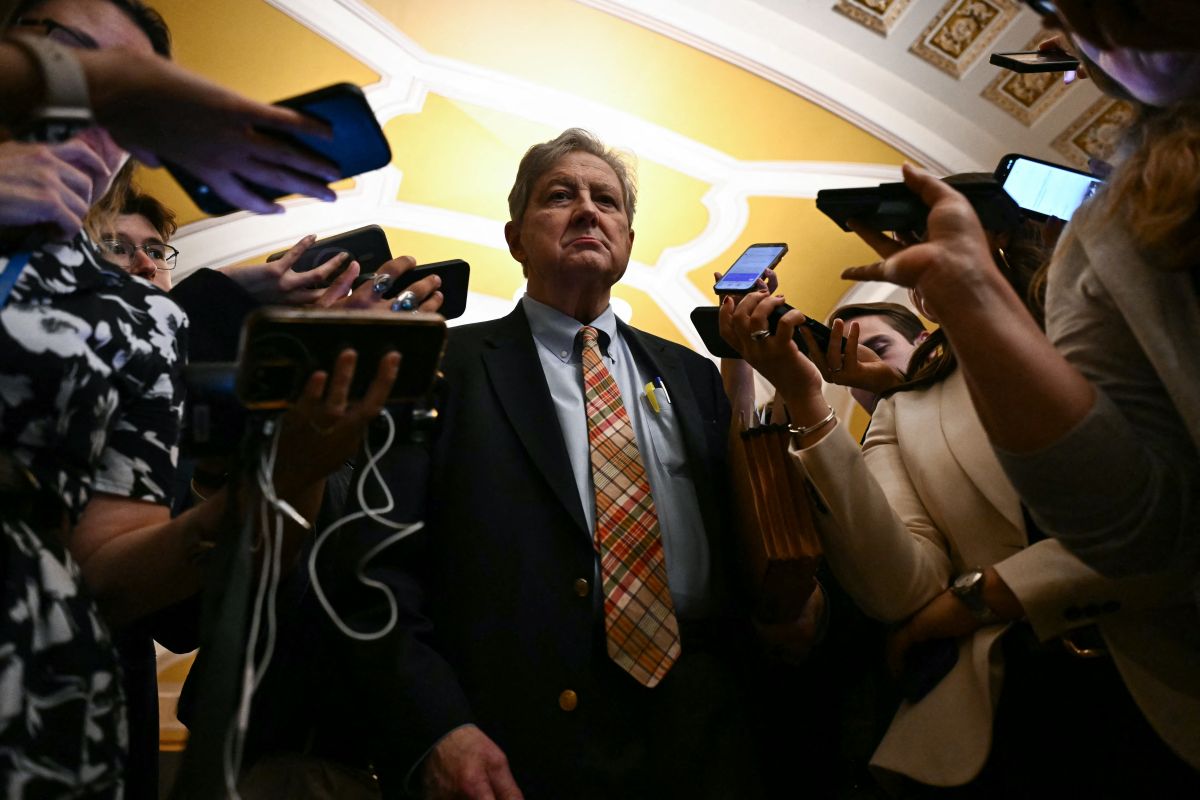 A US senator speaks to reporters outside the Senate chamber at the US Capitol in Washington