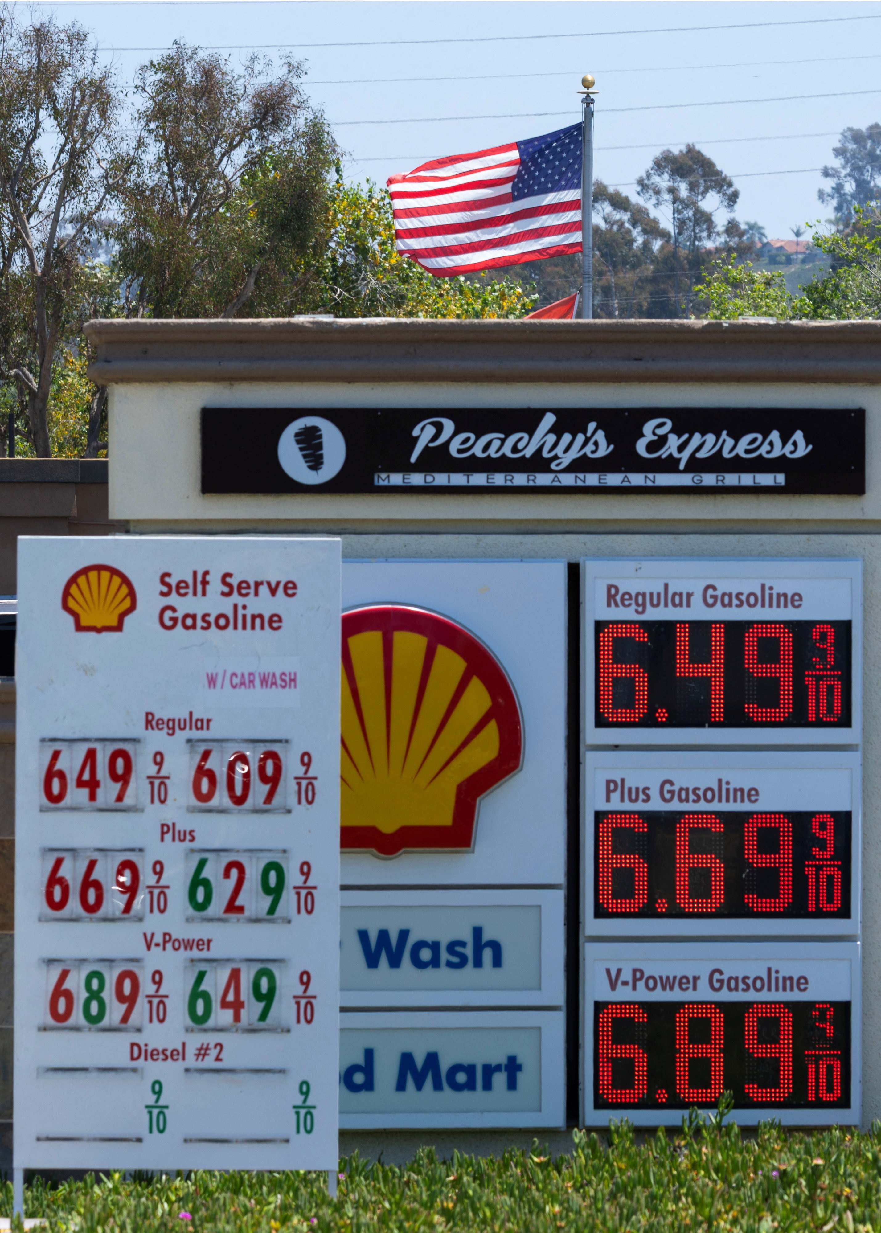 A gas station displays fuel prices