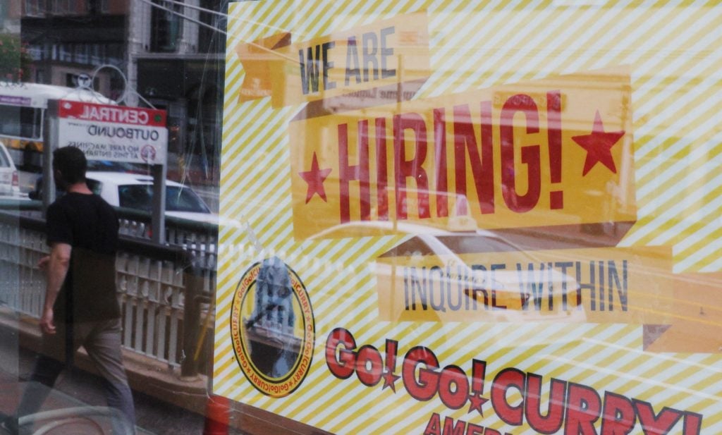 A hiring sign posted outside businesses in Cambridge Massachusetts as US job openings data surged in April 2026