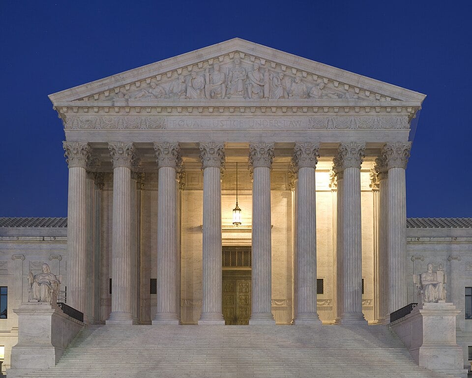 The United States Supreme Court building in Washington D.C. at dusk, where the Wolford v. Lopez Hawaii gun ruling was handed down