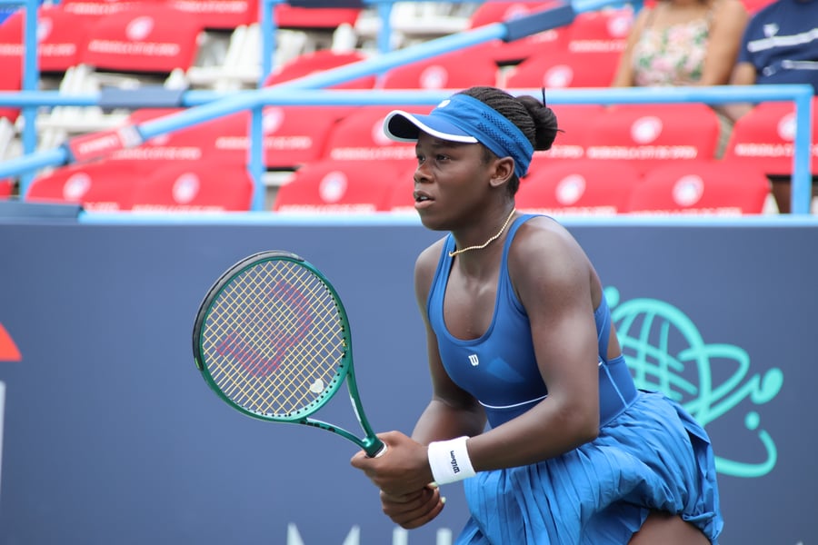 Victoria Mboko, Serena Williams's 19-year-old doubles partner at Queen's Club, hitting a backhand at the 2025 DC Open