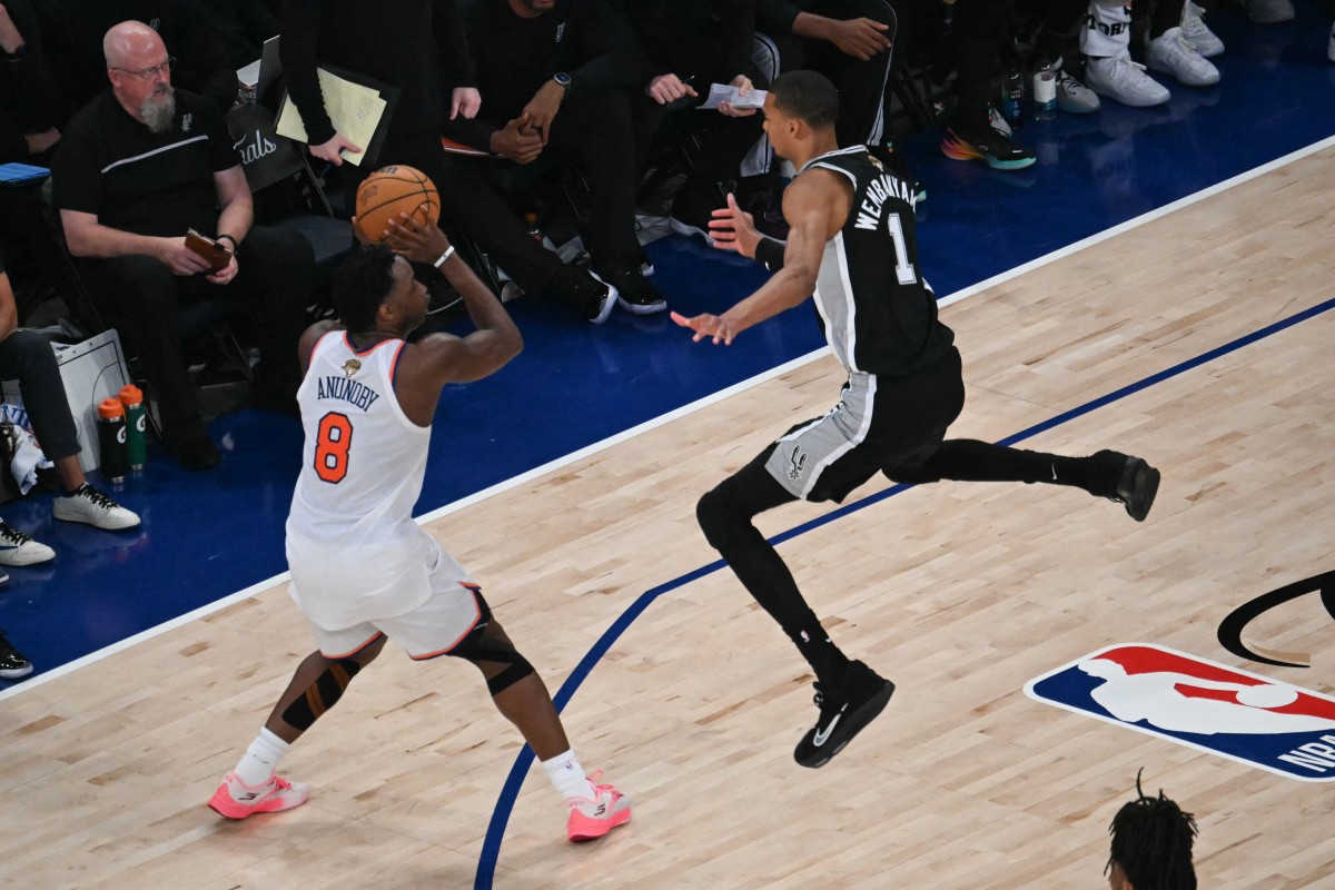 Victor Wembanyama of the San Antonio Spurs defends OG Anunoby of the New York Knicks during Game 3 of the 2026 NBA Finals