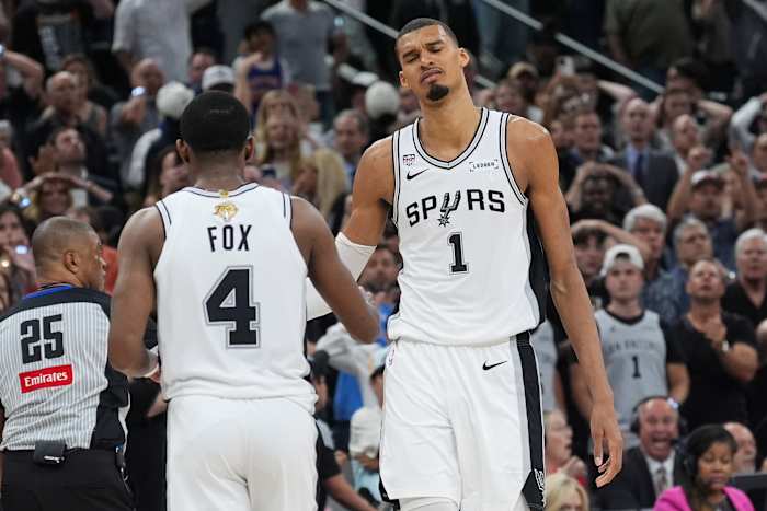 Victor Wembanyama and De'Aaron Fox of the San Antonio Spurs react after a foul call in Game 2 of the 2026 NBA Finals