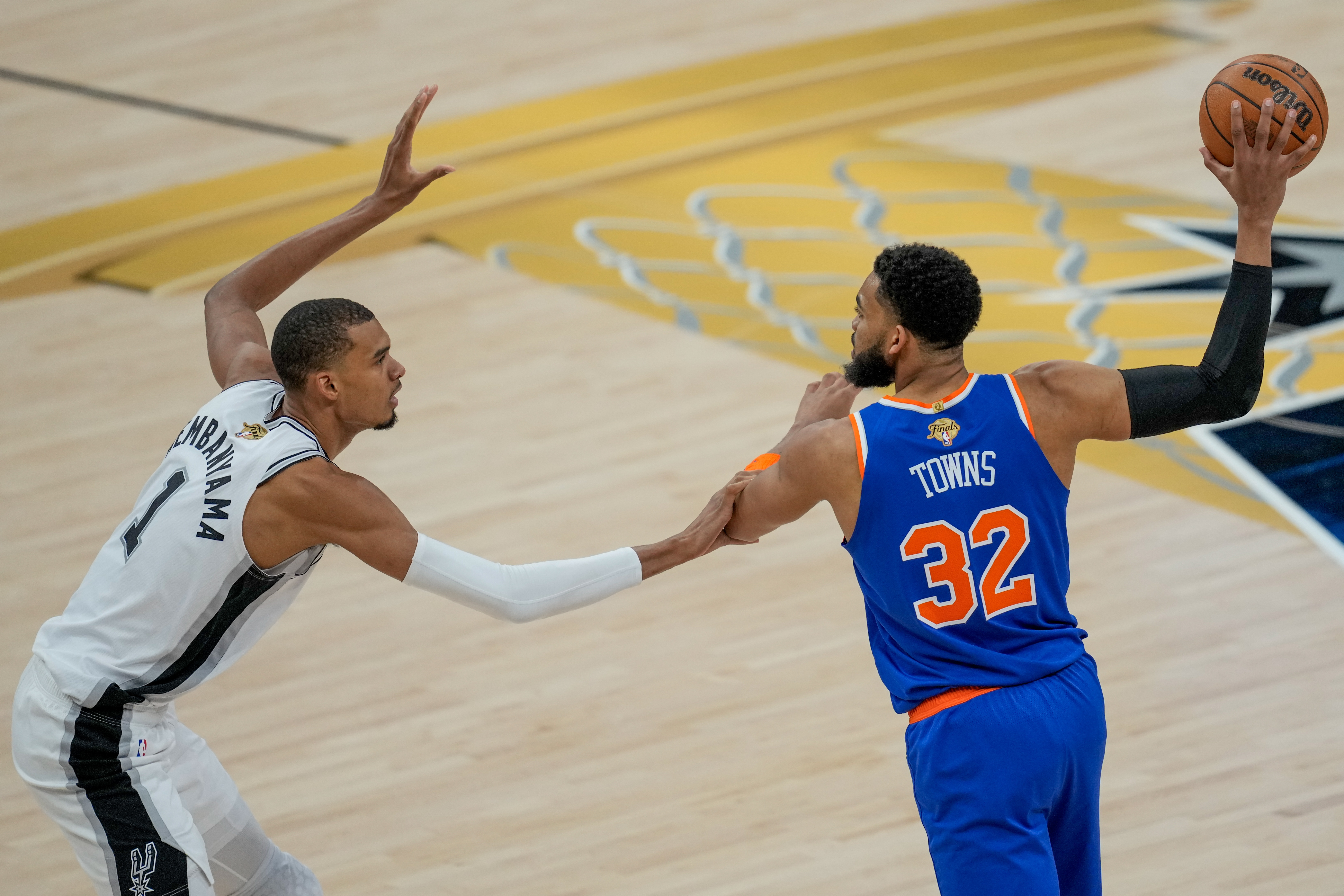 Victor Wembanyama defends Karl-Anthony Towns during Game 2 of the 2026 NBA Finals at Frost Bank Center