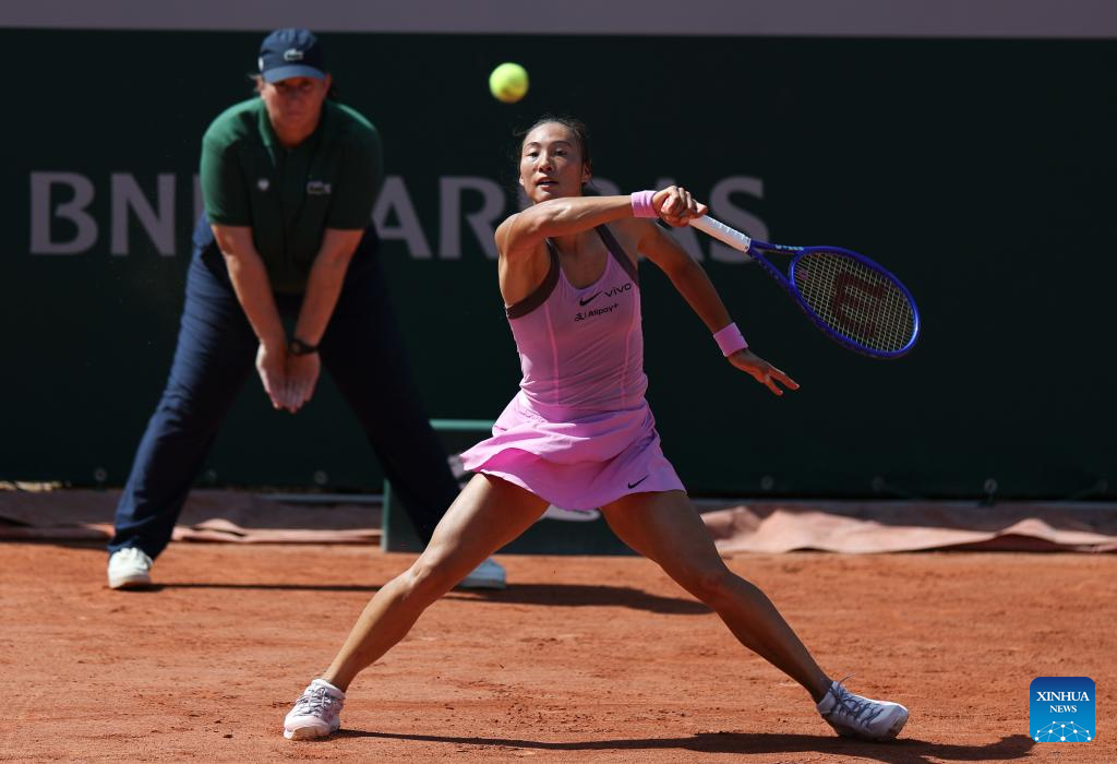 Zheng Qinwen hits a return during her French Open 2026 first round match