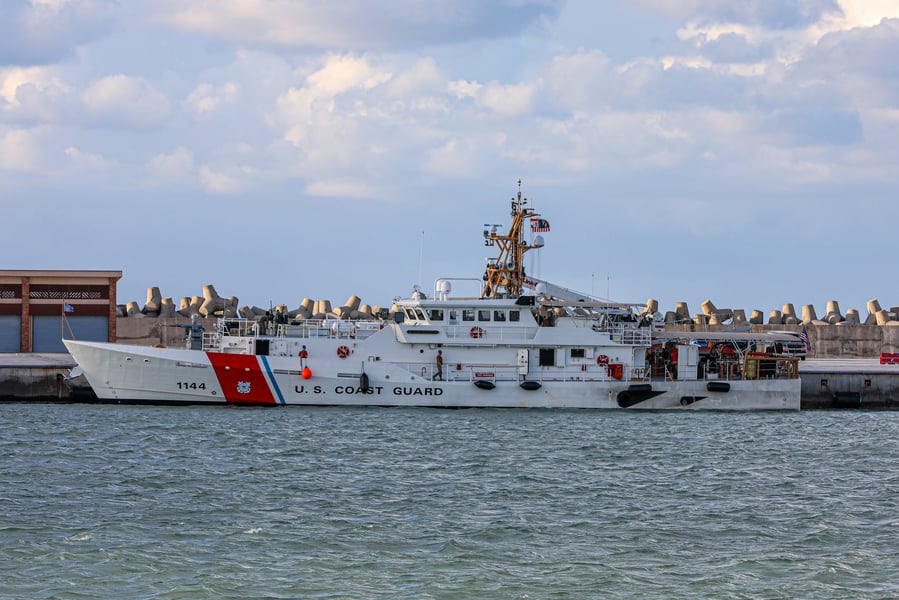 US Coast Guard Fast Response Cutter Glen Harris transiting the Strait of Hormuz with Iranian coastline in the background