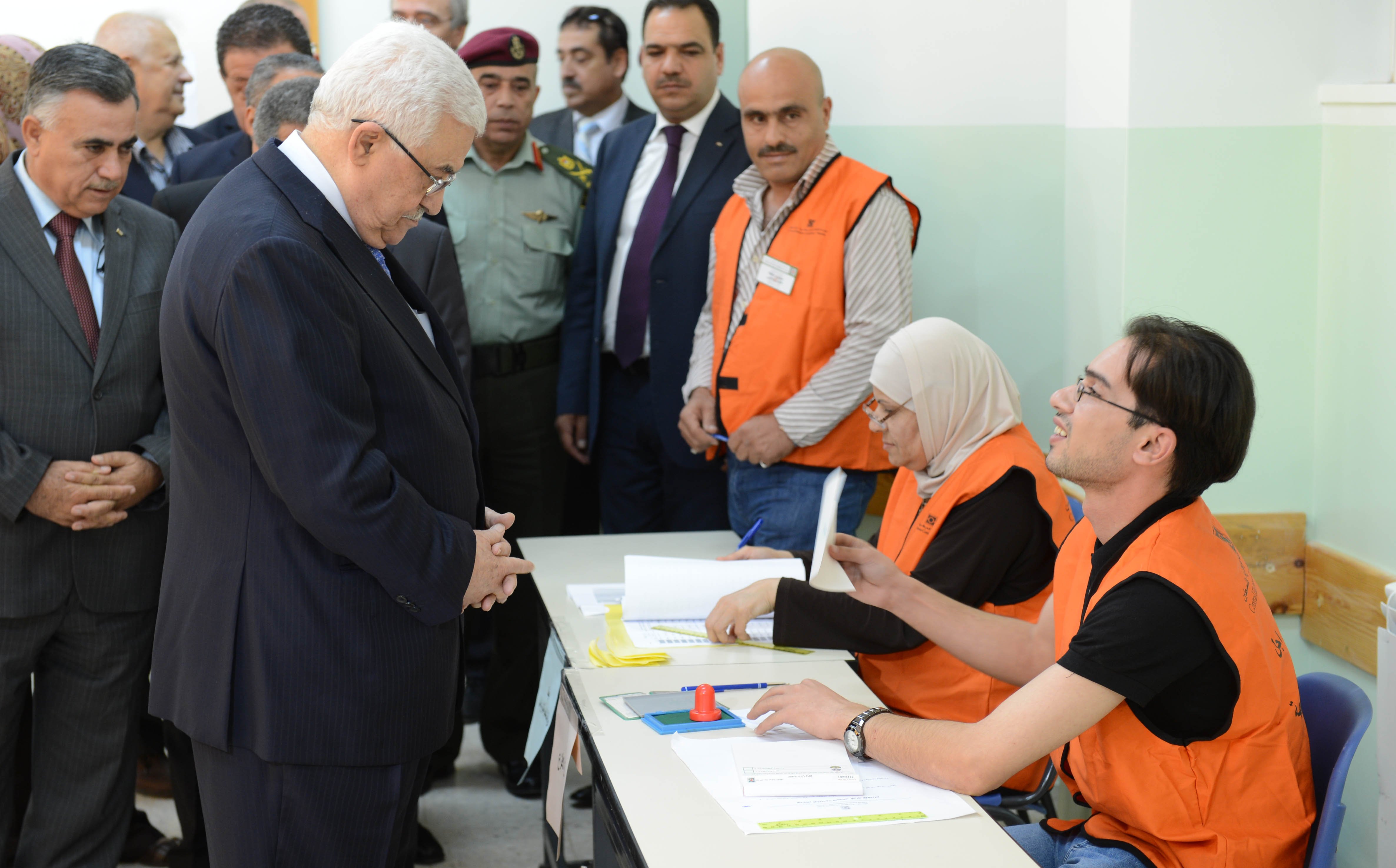 Palestinian President Mahmoud Abbas casts ballot at polling station