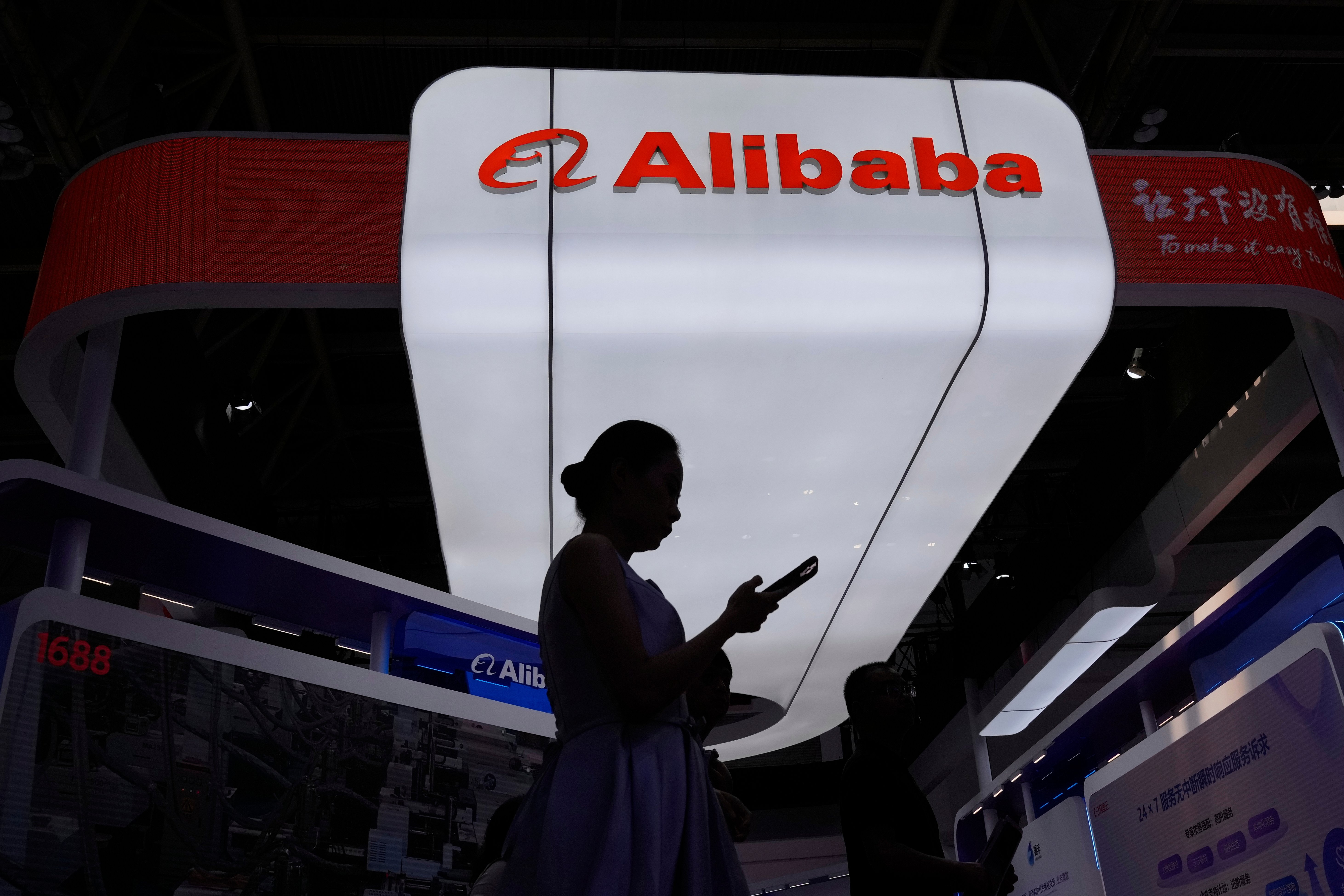 Alibaba logo and e-commerce platform as company agrees to $600 million DOJ settlement over illegal drug sales