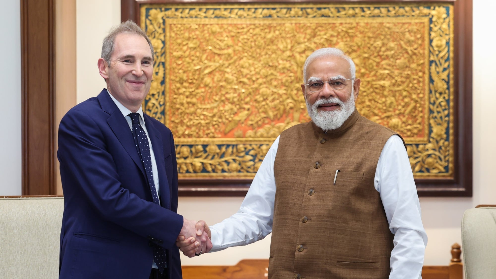 Amazon CEO Andy Jassy shakes hands with Indian Prime Minister Narendra Modi in New Delhi