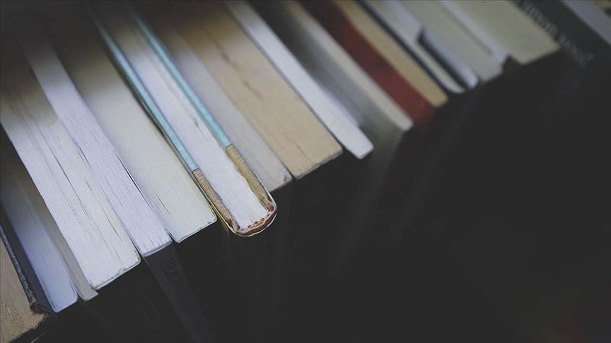 Books representing the AI copyright dispute as Anthropic settles $1.5 billion claim over training data