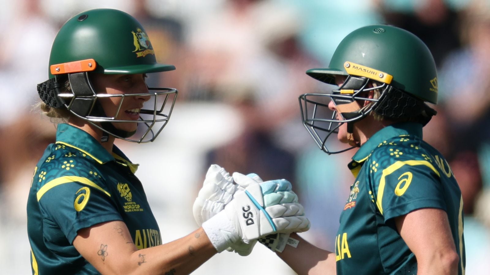 Beth Mooney and Ashleigh Gardner celebrate Australia's eight-wicket win over West Indies in the Women's T20 World Cup semifinal at The Oval