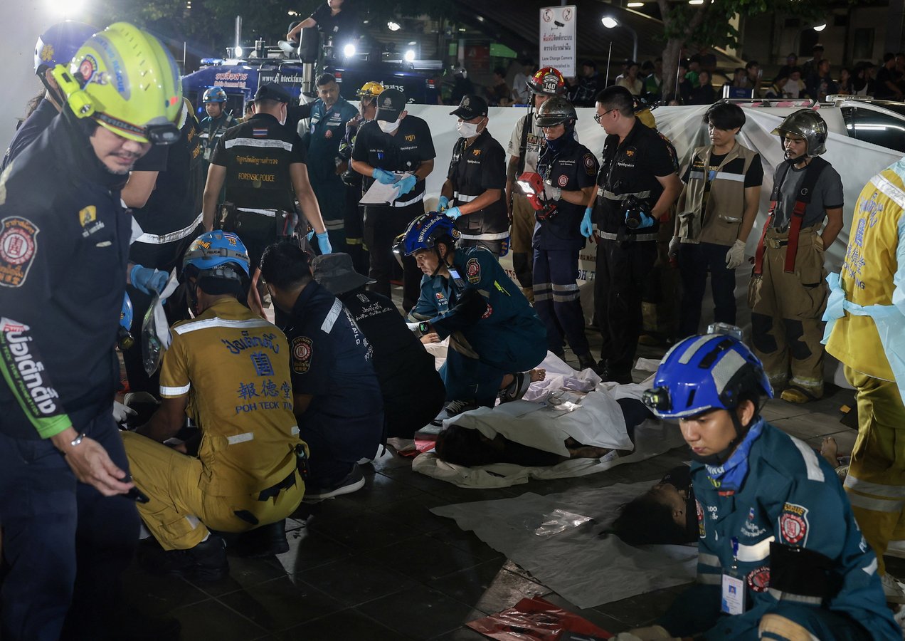 Emergency personnel respond to the Bangkok pub fire at Rong Beer Na Lat Phrao pub in Lat Phrao district Bangkok Thailand