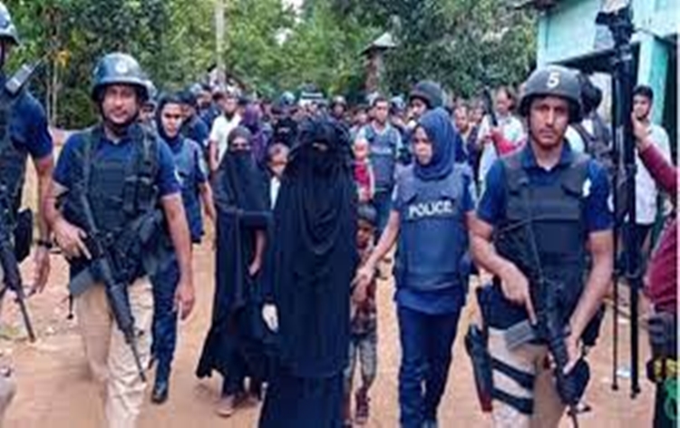 Bangladesh counter-terrorism police officers detain suspected Islamic extremists during an anti-militant operation