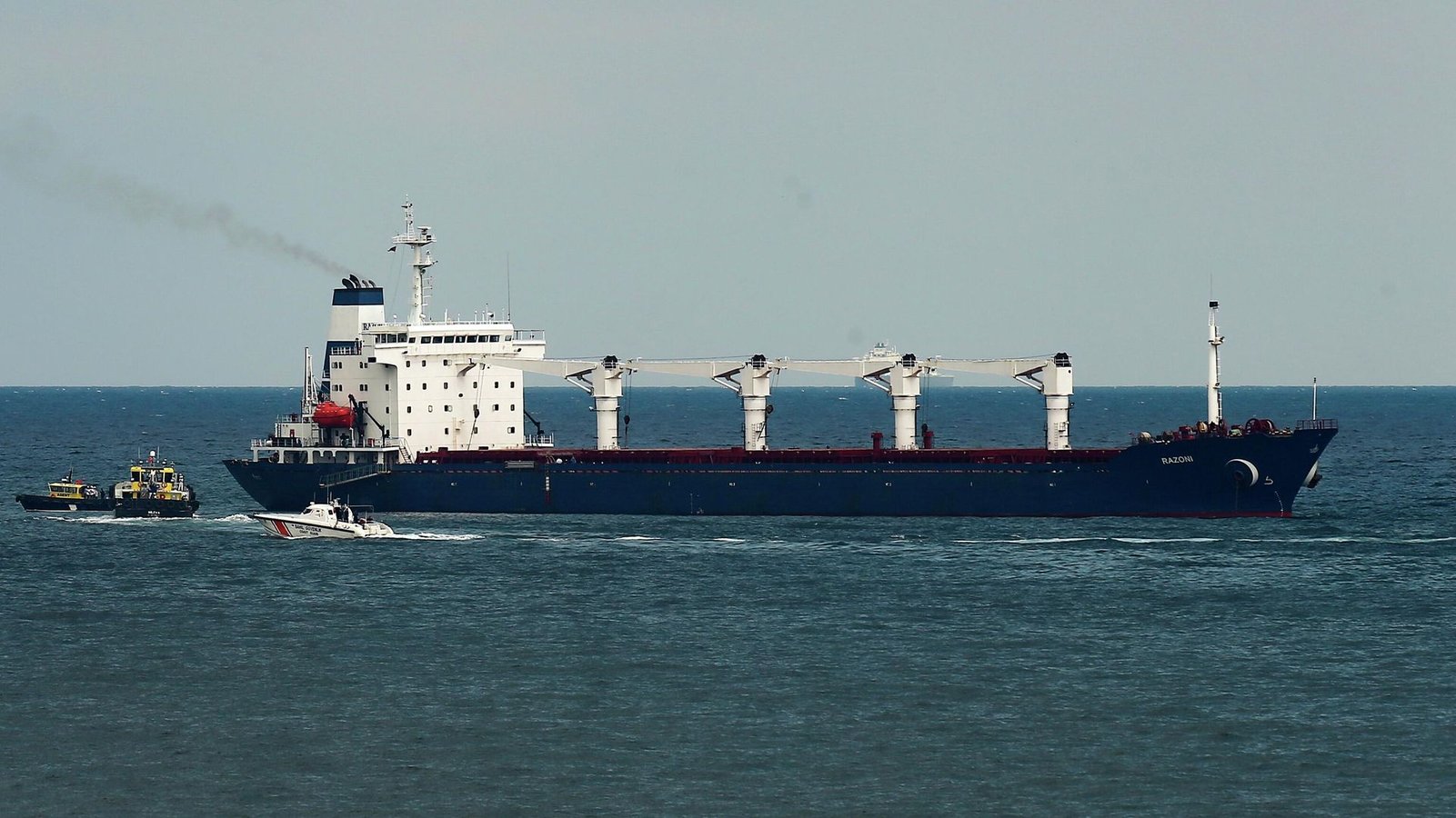Inspection officials board a cargo vessel in the Black Sea under the grain deal