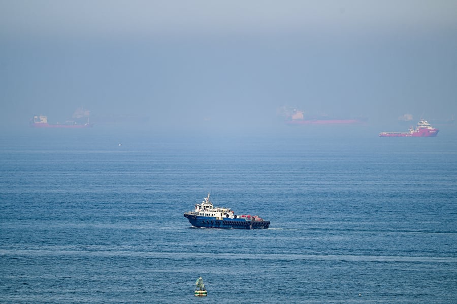 Cargo ships off the Khor Fakkan Container Terminal along the Gulf of Oman near the Strait of Hormuz, June 2026