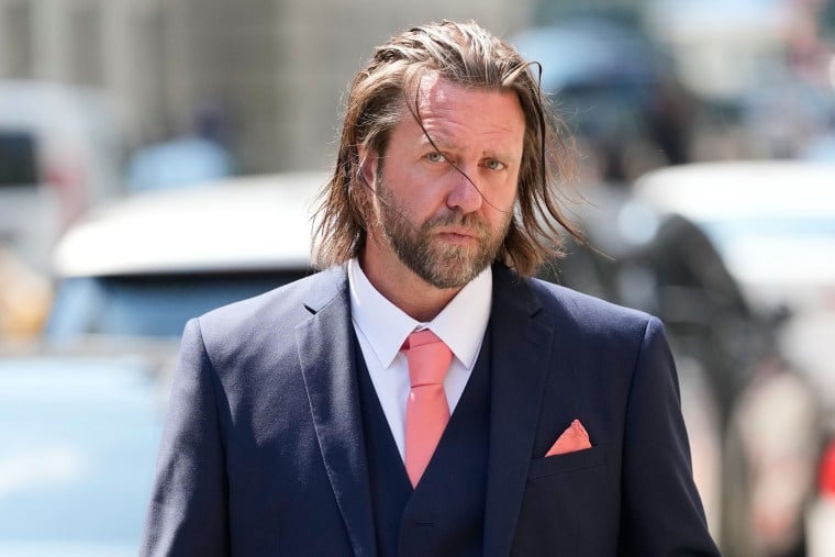 Director Carl Rinsch leaves a federal courthouse in New York after being sentenced to 30 months in prison for defrauding Netflix out of $11 million