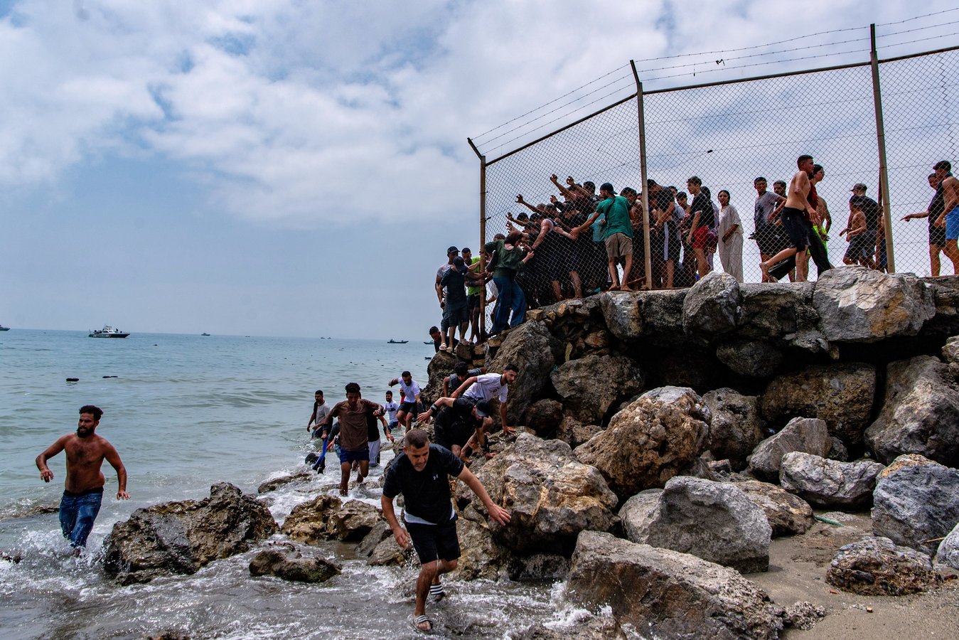 Migrants swimming to reach Spain's Ceuta enclave from Morocco on July 30, 2026