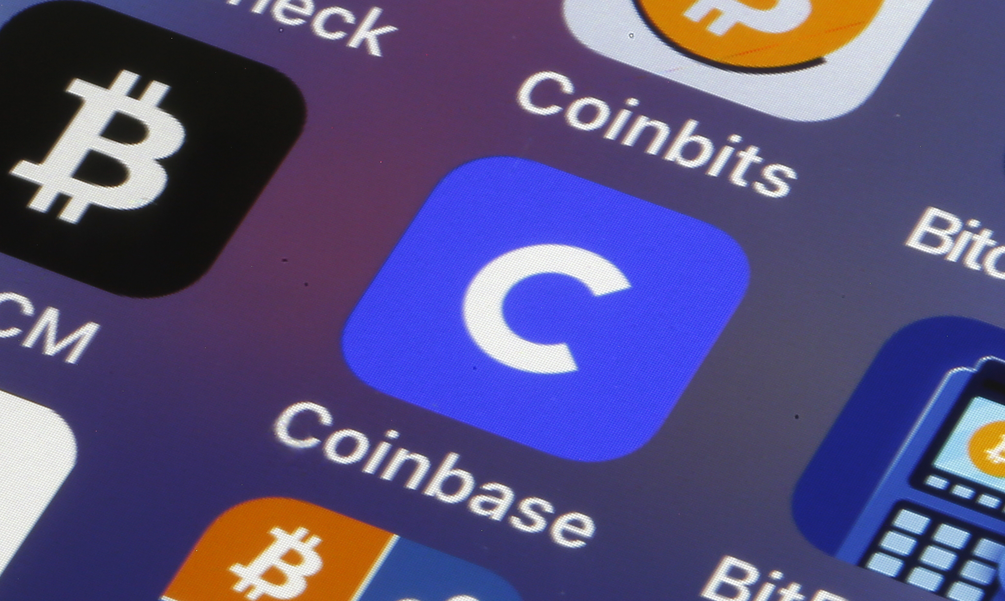 Coinbase logo displayed on a trading screen, representing the crypto exchange's major role in 2026 US midterm election spending