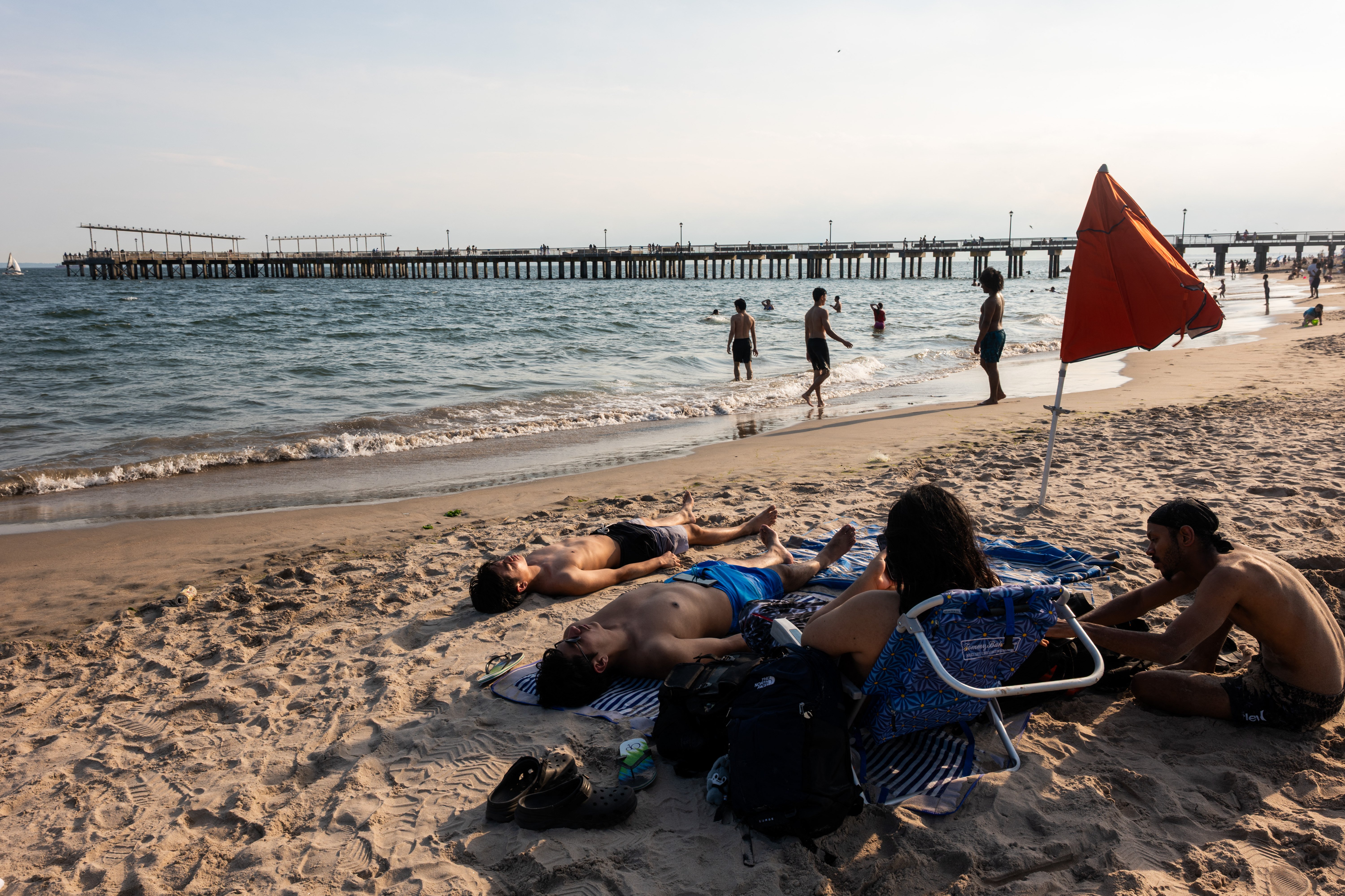 Beachgoers crowd Coney Island in New York City seeking relief from the record heat wave affecting the Eastern United States, July 2026