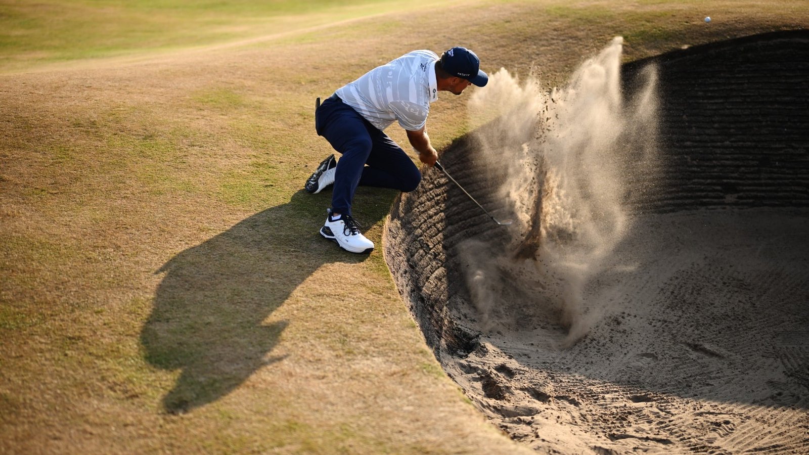 Bryson DeChambeau plays from a bunker during the 154th Open Championship at Royal Birkdale Golf Club near Southport, England.