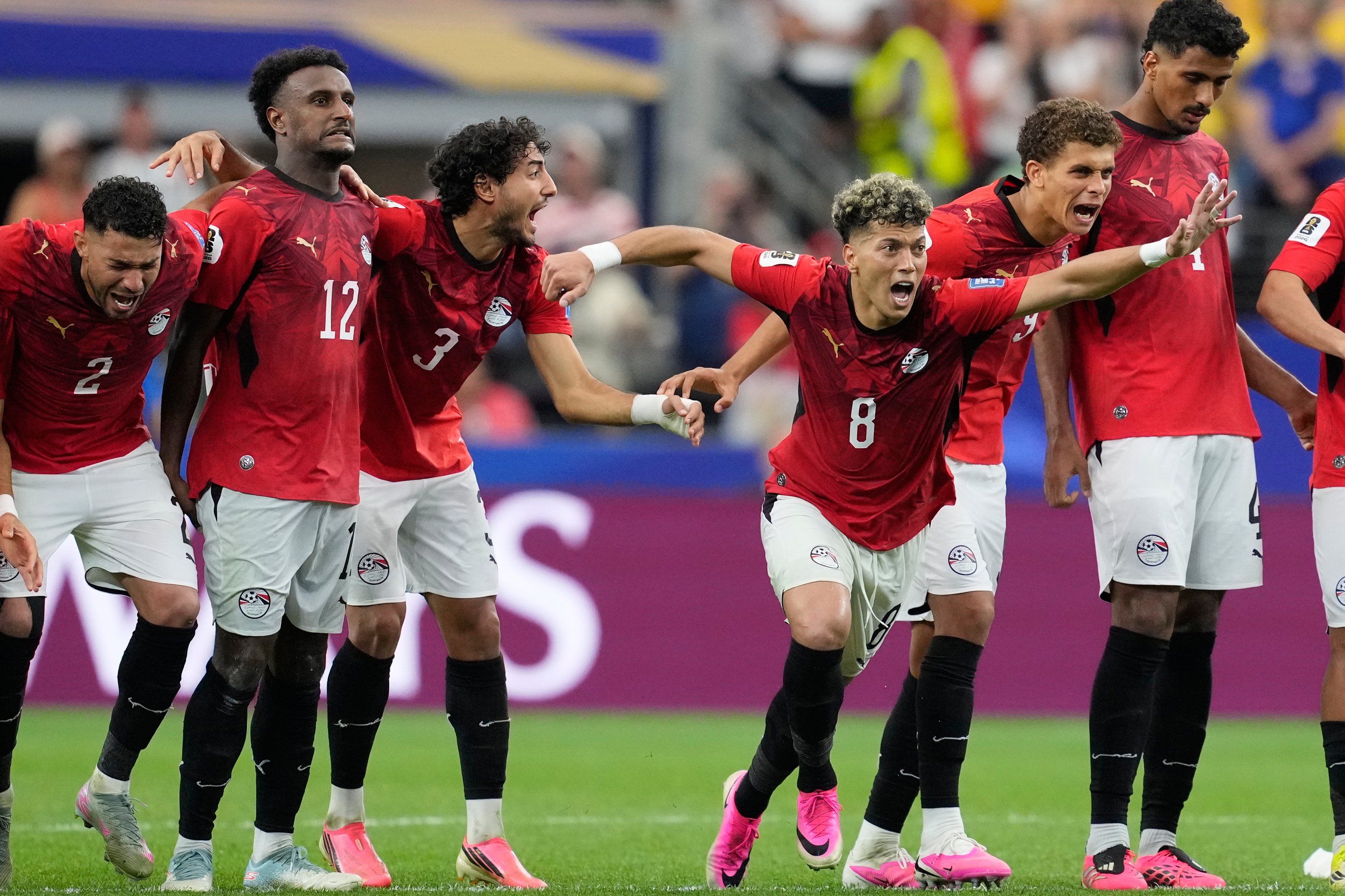 Egypt players celebrate after defeating Australia 4-2 on penalties in the 2026 FIFA World Cup Round of 32 in Arlington Texas